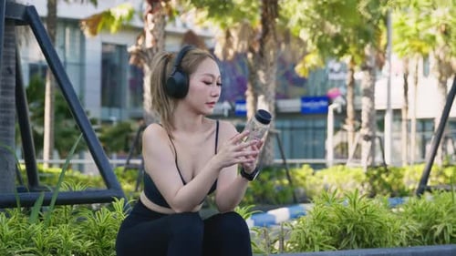 Young Woman Sport Athlete Active Lifestyle Exercising Outdoors in City Park Environment Enjoying
