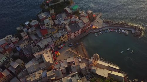 Rising aerial view above coastal town of Vernazza Cinque Terre Italy