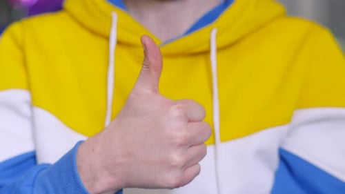 Male Person Giving Thumbs Up to an Idea or Action.