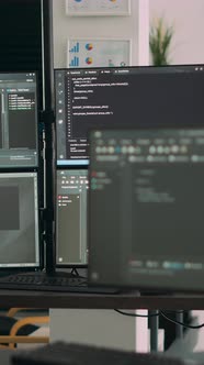 Vertical Video Computer Screens on Desk in Empty Data Room Displaying ...