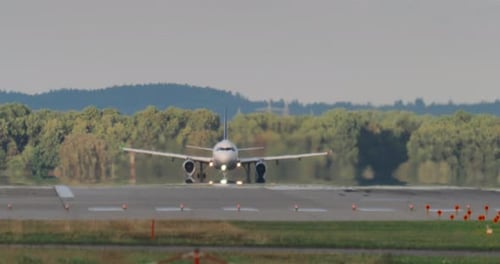 Airplane Takes Off From Airport Runway