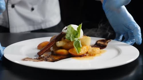 Chef Presents Elegant Fruit Dessert on Plate