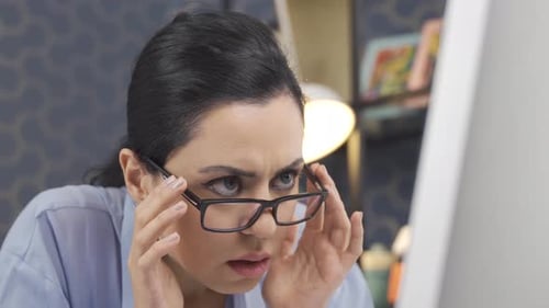 Business woman is puzzled and doing mysterious work in the office.