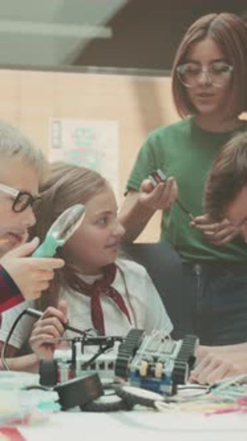 Children Learning STEM Skills Building Robotics Project