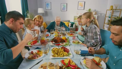 Multi-Generation Family Enjoying Feast Together at Home