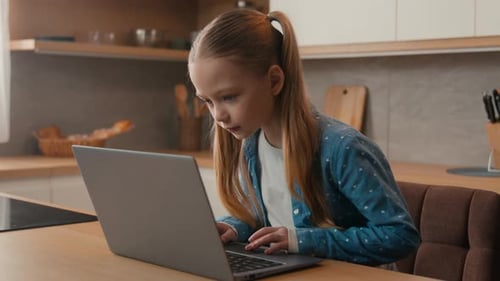 Caucasian Little School Girl with Computer Watching Internet Website Child Kid Schoolgirl Daughter