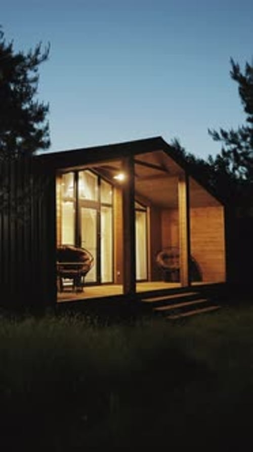 Tranquil Wooden Cabin in Forest at Twilight