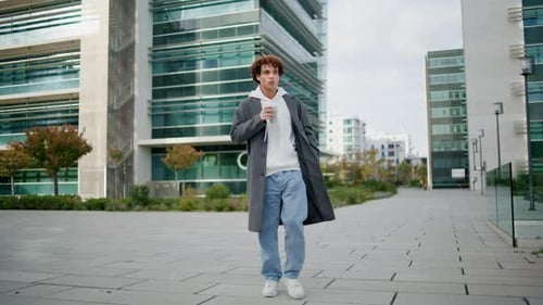 Relaxed Student Walking Downtown Alone Trendy Guy Enjoying Espresso in Street