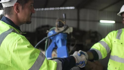 Engineer work at robotic arm factory.