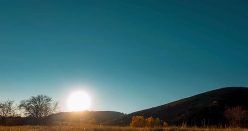 Mountain Meadow Timelapse at the Summer or Autumn Sunset Time Wild Nature and Rural Field Clear Sky