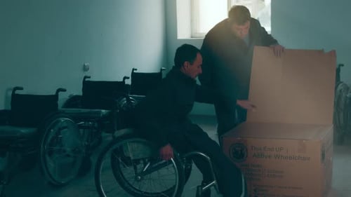 A Disabled Man Assembles a Stroller