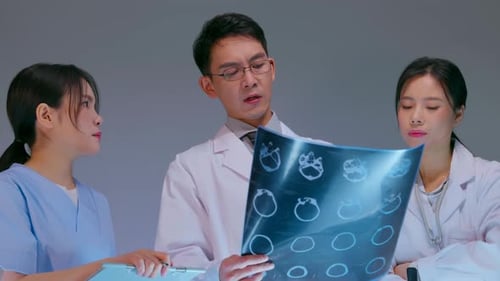 Healthcare Professionals Analyzing X-Ray in Clinic