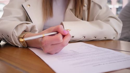 Woman signs business contract