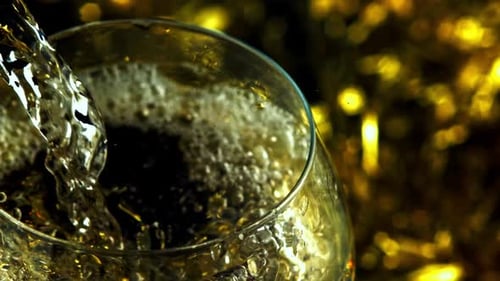 Champagne Poured into Glass with Splash and Bubbles