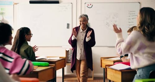 Teacher, woman and children for applause in classroom, achievement and smile for goals at school
