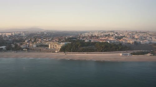 Aerial view over Forte de São João das Maias in Santo amaro of Oeiras, sunset in Portugal - drone sh