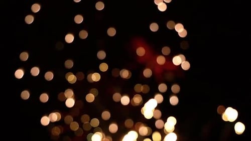 Golden Bokeh Lights Shimmering at Night