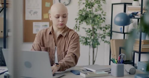 Young Business Lady Working with Laptop and Chatting on Mobile Phone Smiling Alone in Office