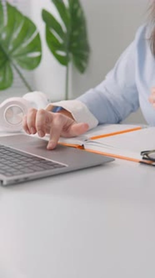 Close Up of Hand Using Laptop Trackpad
