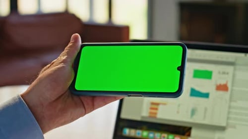 Phone With Chroma Key Screen Held by Hand