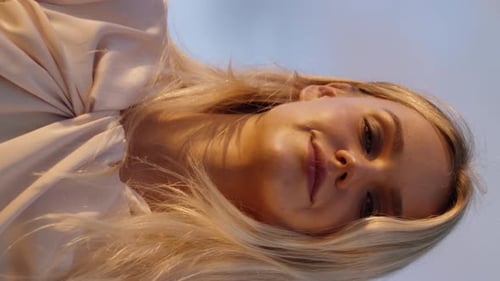 Blonde Woman Smiling and Posing in Dress