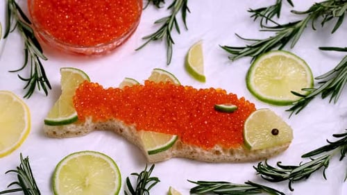 Fish Shaped Sandwich with Caviar and Limes