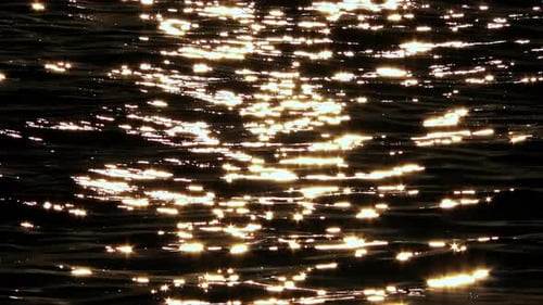 Sunlight Sparkling on Rippling Ocean Surface at Sunset