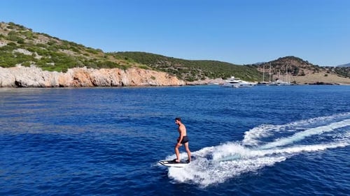 Electric Surfboarding Adventure on a Tropical Ocean