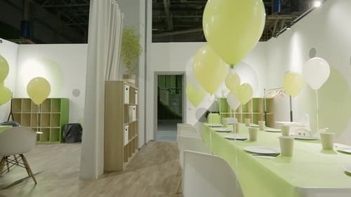 Decorated Party Room with Balloons and Table Setting