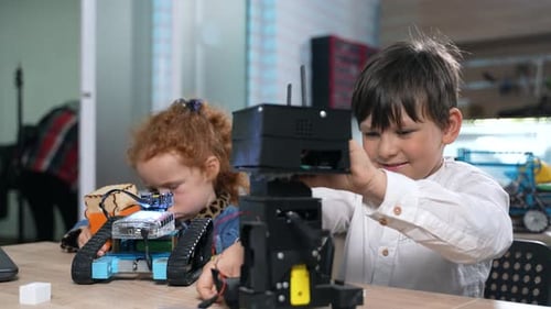 Elementary Students Assembling Robotics at School