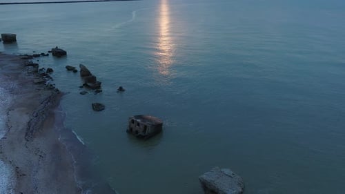 Beautiful aerial establishing view of Karosta (Liepaja) concrete coast fortification ruins, vibrant