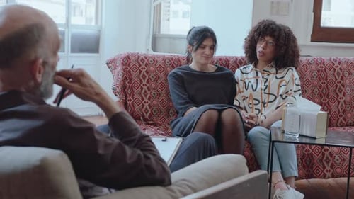 Counseling Session with Therapist and Two Young Adults
