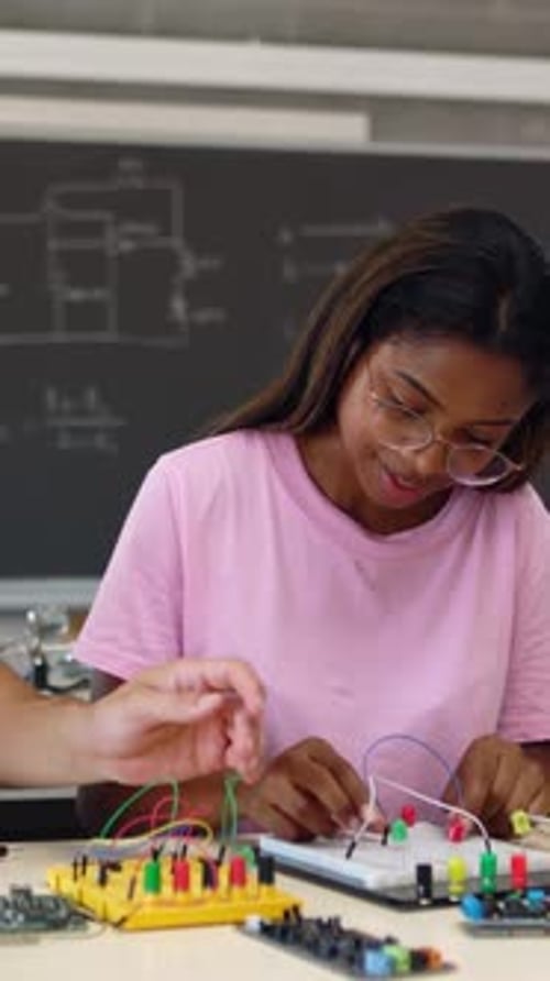 Group of Diverse Teenage Students Learning Together at Technology Class