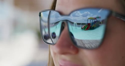Reflection of Water Park in Sunglasses