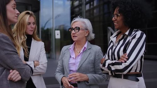 Team of Cheerful Business Women of Various Ages and Races Happy Outside the Office Building