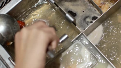 4k video POV to the hotpot shabu shabu in chinese style with vetgetable in pot. Chinese japanese foo