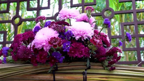 Vibrant Purple and Pink Flowers in a Floral Arrangement