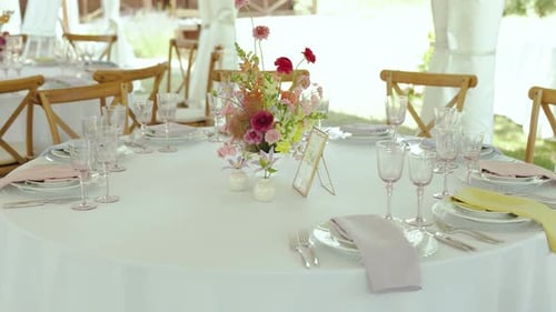 Elegant Wedding Reception Table Set With Floral Centerpiece