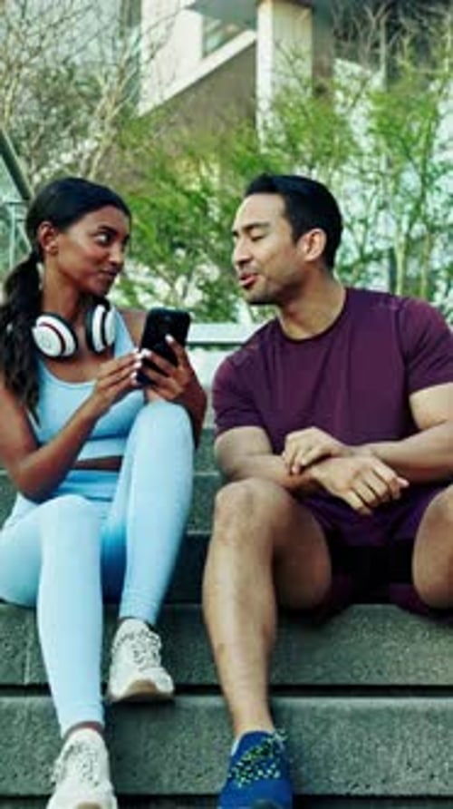 Couple, fitness and break with phone for talk, chat and check stats for wellness review on stairs