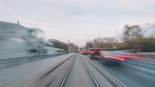Urban Street Time-Lapse with Tram and Car Traffic