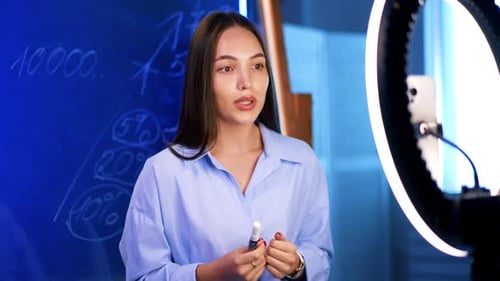 Woman Explaining Business Strategy Near Chalkboard