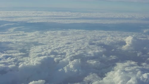 Wide shots of cloudy skies from an airplane