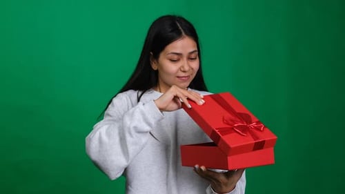 Woman Opens Gift and Dislikes It