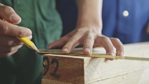 Close Up of Carpenter Marking Length of Timber