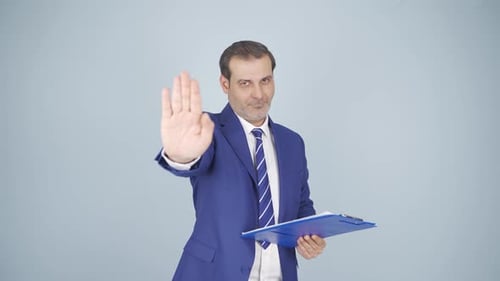 Man Holding Clipboard Gestures Stop