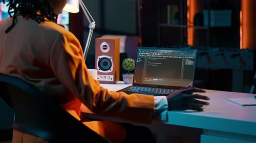 African American It Specialist Working with Coding Language and Infographics