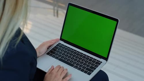 Lady Hands Using Touchpad Green Screen Laptop in Corporate Environment Closeup