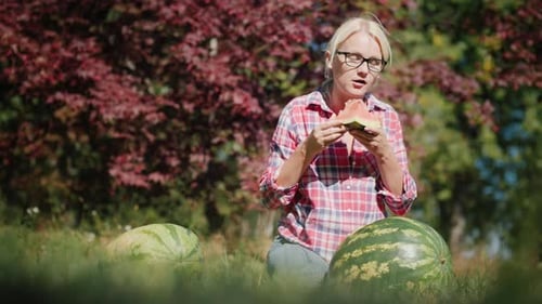 Woman Eating Watermelon Slice on Sunny Day