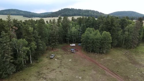 Travelers Tent Camping In Green Peaks Arizona, USA - Drone Shot (Ascending)