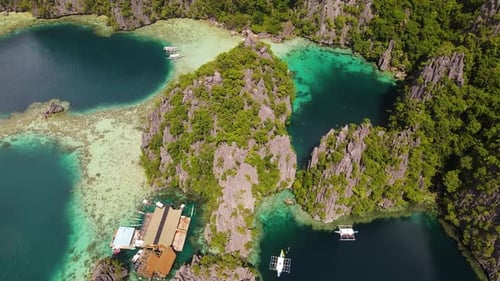 Scenic Twin Lagoon with Boats and Rock Formations on Coron Island, Palawan, Philippines